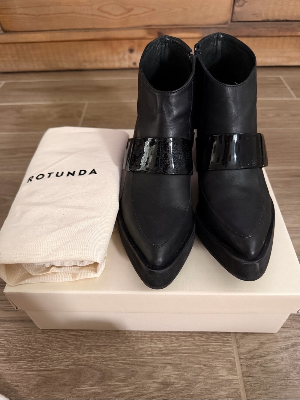 Rotunda Black Pointed Leather Ankle Booties with Patent Strap